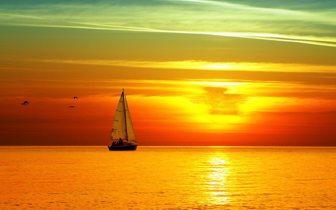 Ảnh nền Mặt Trời đâm chồi trên biển khơi vô cùng đẹp